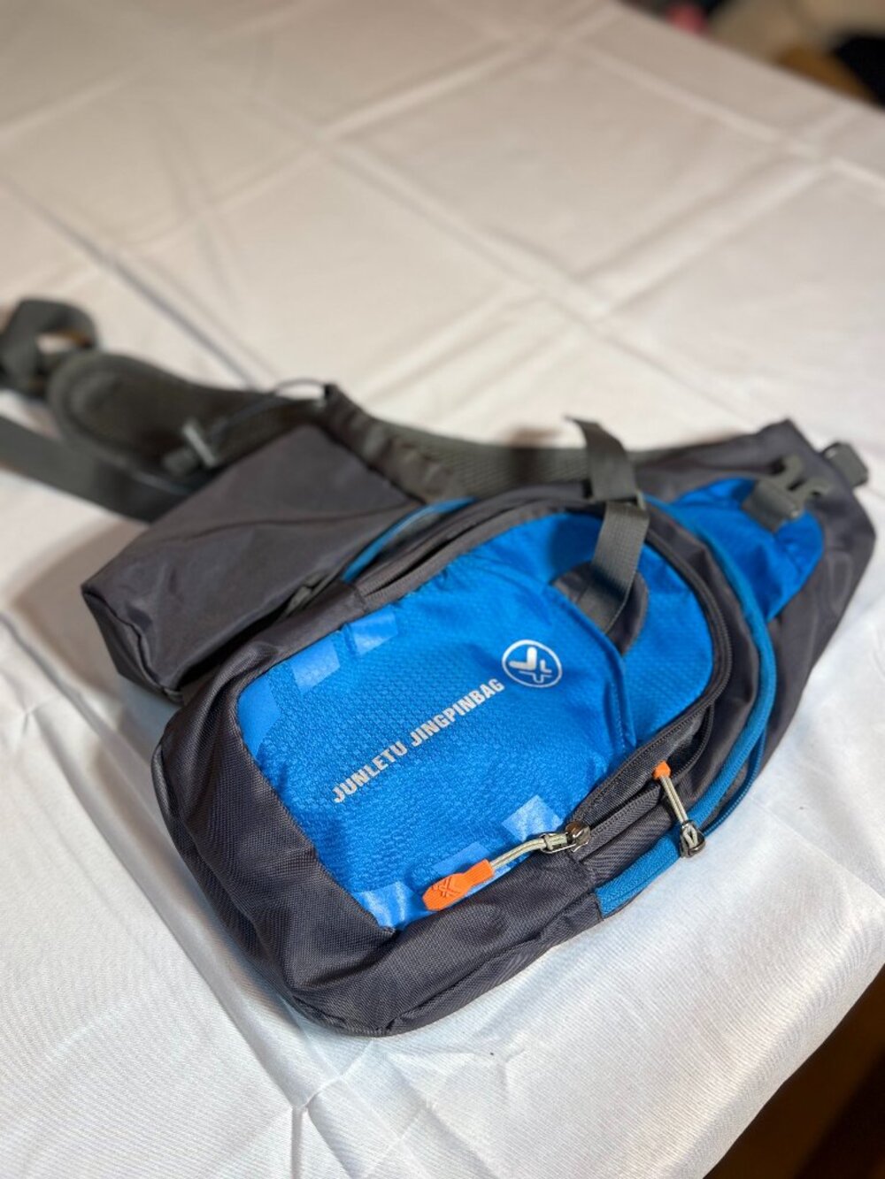 Junletu Jingpinbag Blue and Grey Sling Bag w/drink bottle pocket good condition